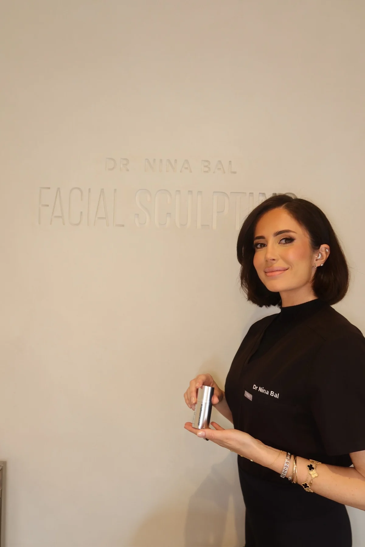 Dr Nina Bal with the Dermalogica Smart Eye Density serum at the Facial Sculpting clinic in South Kensington