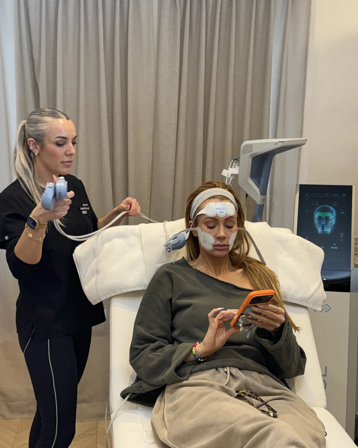 Olivia Attwood trying the EMFACE treatment during filming at Facial Sculpting London
